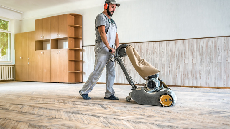Plamada Flooring crew using a dustless hardwood floor sanding system in Kildeer, IL